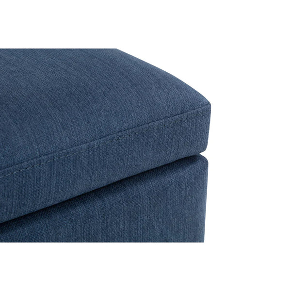 Blue fabric ottoman on a white background