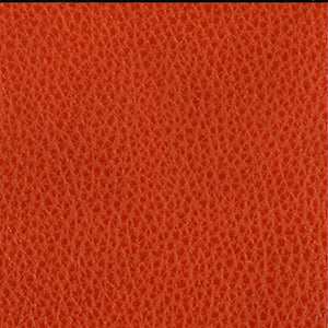 Close-up of a textured orange leather surface