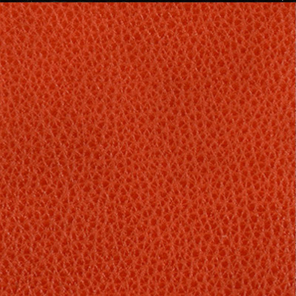 Close-up of a textured orange leather surface