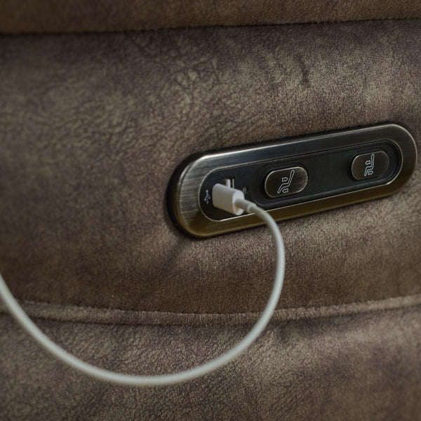 Close-up of a brown leather bag with USB charging port and cable.