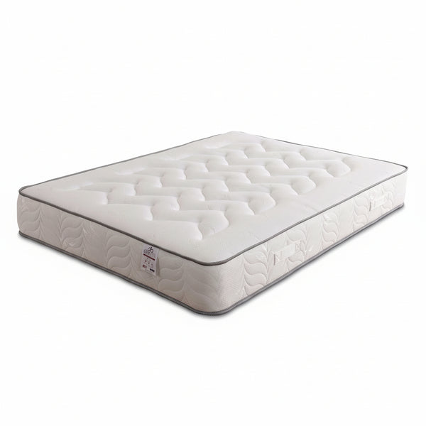 White mattress with brand label on a white background