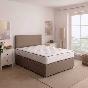 Beige bed with mattress in a bedroom setting