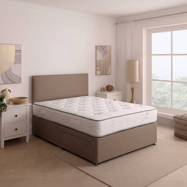 Beige bed with mattress in a bedroom setting