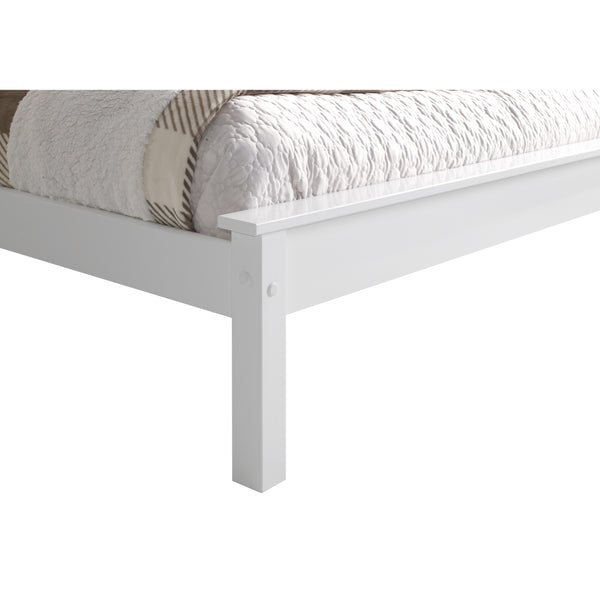 White wooden bed frame with a partially made bed featuring a plaid blanket and white bedding.