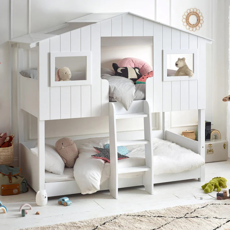 White children's bunk bed with a ladder on a white background