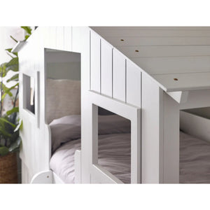 White bunk bed with wooden floor and ceiling in a room setting.