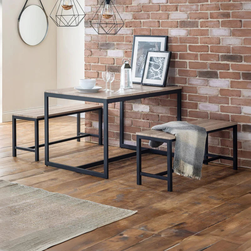 Long wooden table with black metal frame on a white background