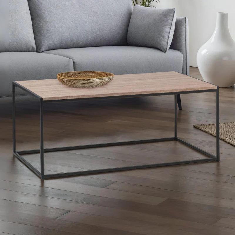 Coffee table with wooden top and black metal frame on a white background