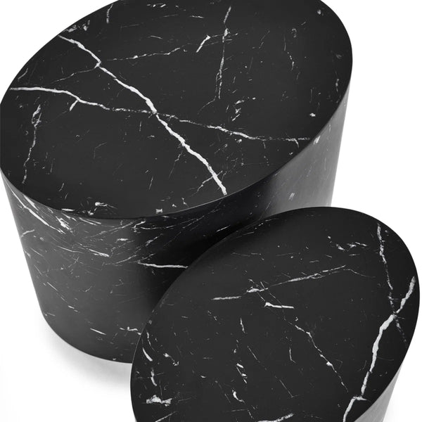 Two black marble side tables on a white background