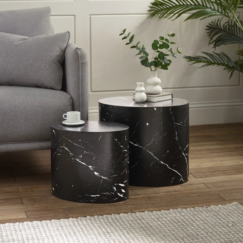 Black marble cylindrical side table on a white background