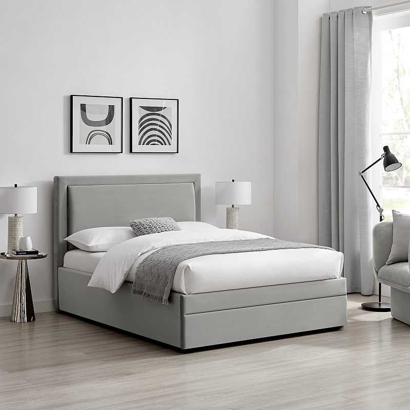 Gray upholstered bed with white mattress on a white background