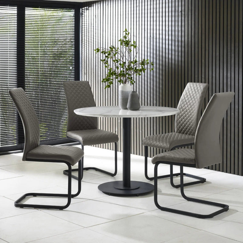 Gray quilted chair with black metal legs on a white background