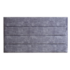 Gray upholstered headboard with a textured finish on a white background