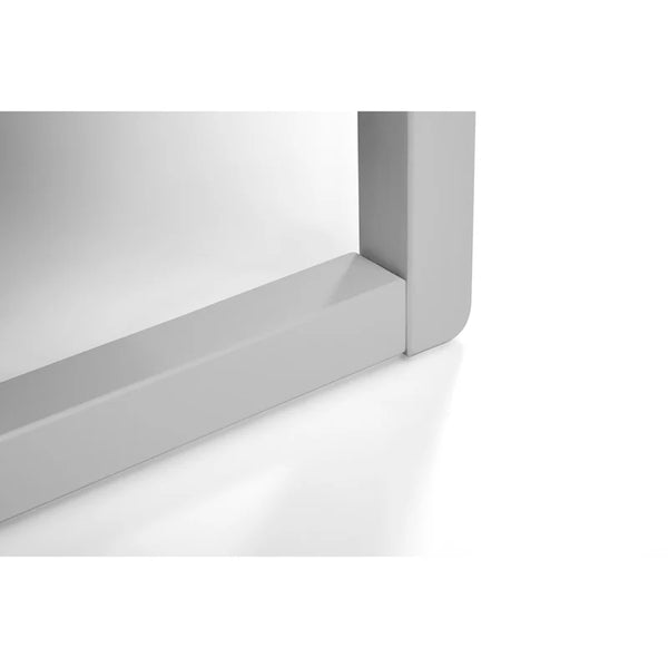 White rectangular object with a reflective surface on a white background