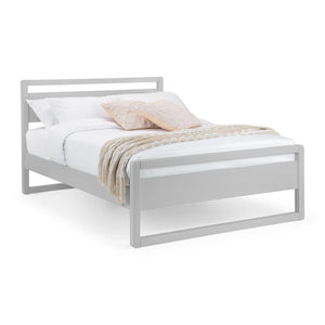 White metal bed frame with bedding on a white background