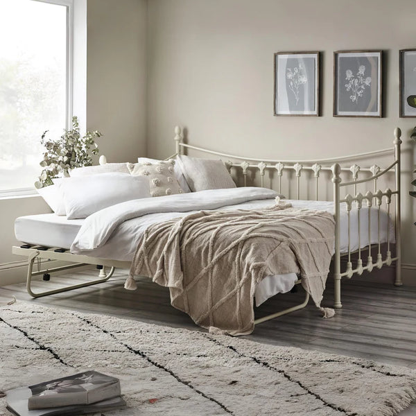 Neatly made bed in a bedroom with decorative elements