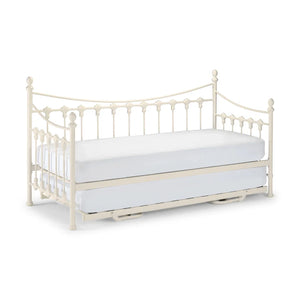 White metal daybed with trundle on a white background