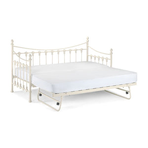White metal bed frame with mattress on a white background