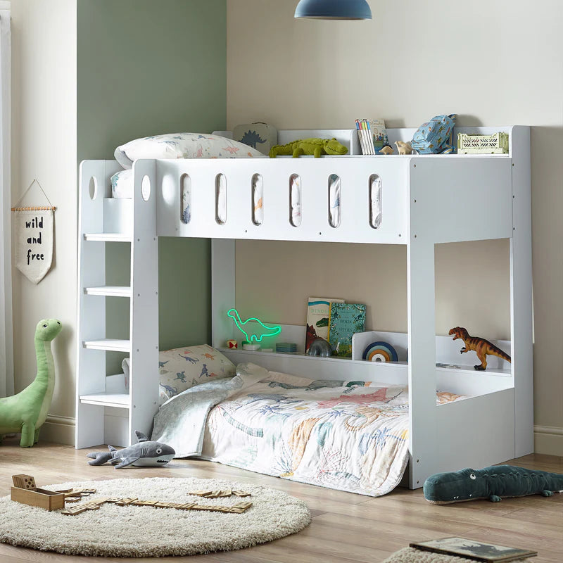 White bunk bed with floral bedding on a white background