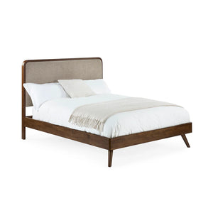 Bed with wooden frame and upholstered headboard on a white background
