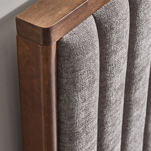 Close-up of a wooden frame and gray textured fabric