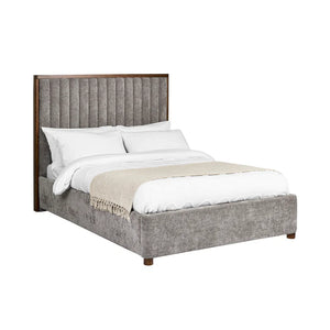Gray upholstered bed with white bedding on a white background
