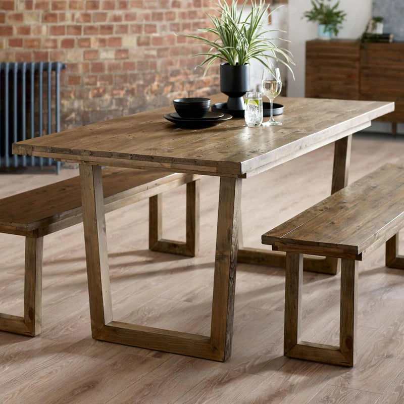 Wooden dining table on a white background
