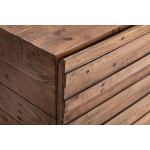 Close-up of a wooden drawer with a rustic finish