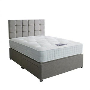 Gray upholstered bed with white mattress on a white background