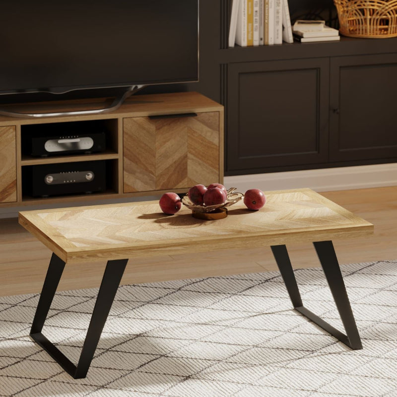 Wooden coffee table with black metal legs on a white background