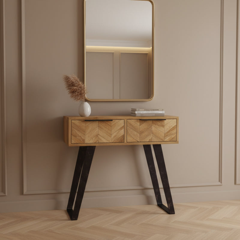 Wooden console table with black metal legs on a white background