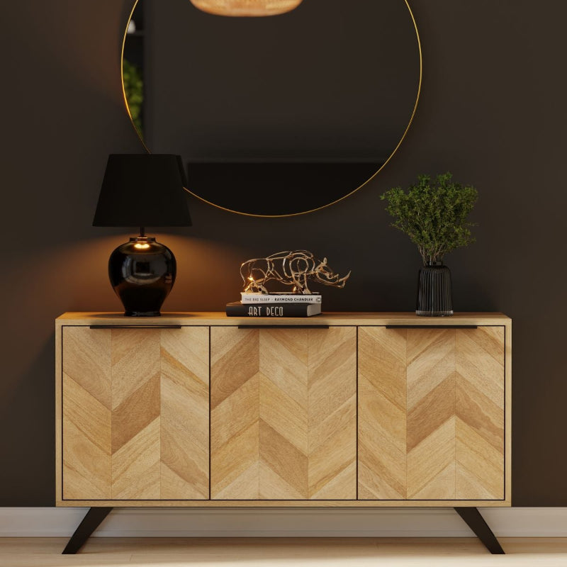 Wooden sideboard with chevron pattern and black legs on a white background