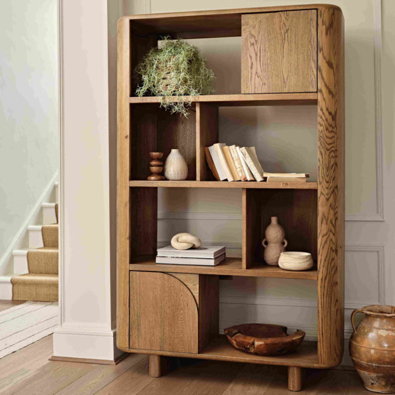 Wooden bookshelf with geometric design on a white background