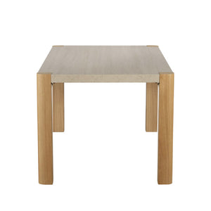 Small square table with light wood legs and a beige top on a white background