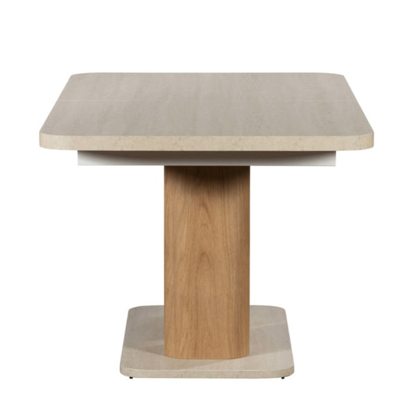 Wooden dining table with a light wood base and beige top on a white background