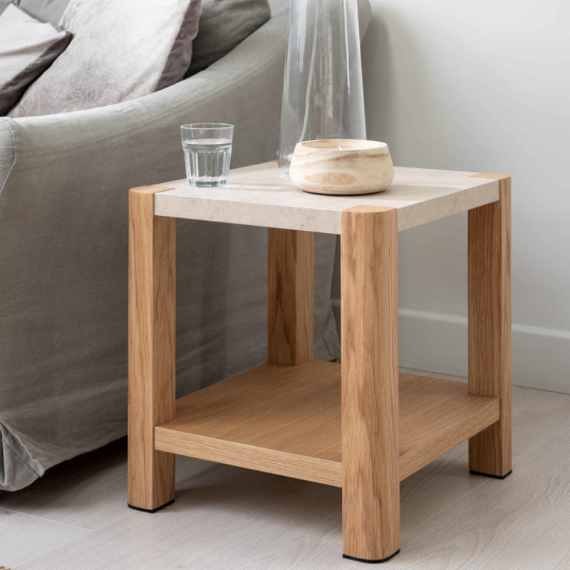 Wooden side table with a light finish on a white background