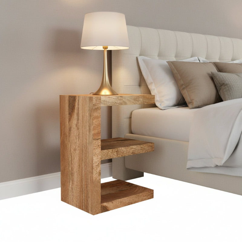 Wooden bookshelf with three shelves on a white background
