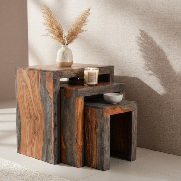 Set of three wooden nesting tables in a room setting