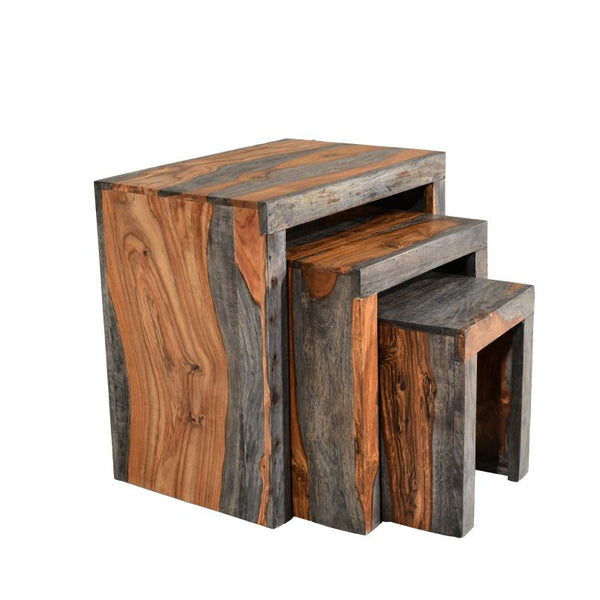 Set of three wooden nesting tables with a rustic finish on a white background
