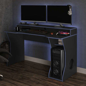 Gaming setup with dual monitors, gaming chair, and desk in a room.