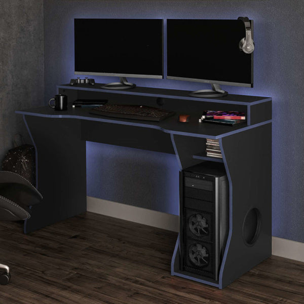 Gaming setup with dual monitors, gaming chair, and desk in a room.