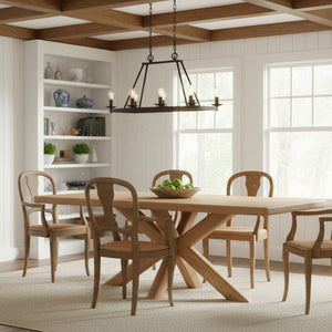 Dining room with wooden table and chairs, bookshelf, and large windows.