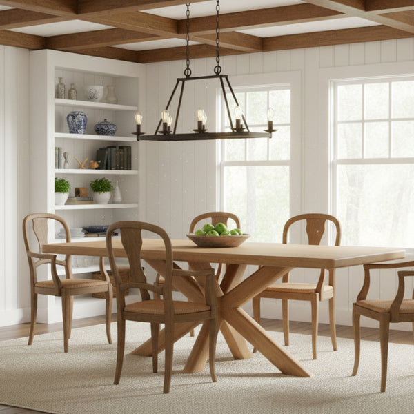 Dining room with wooden table and chairs, bookshelf, and large windows.