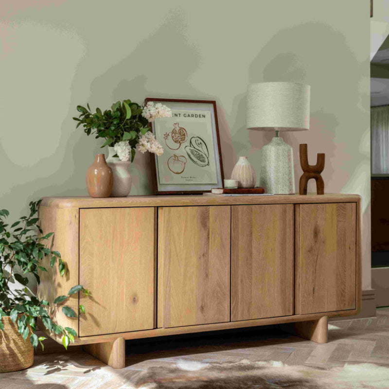 Wooden sideboard with three doors on a white background
