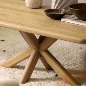 Wooden table with ceramic items on a textured surface