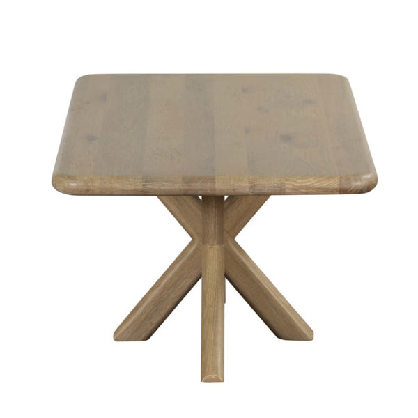 Wooden table with a square top and X-shaped legs on a white background
