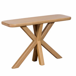 Wooden table with a unique X-shaped base on a white background
