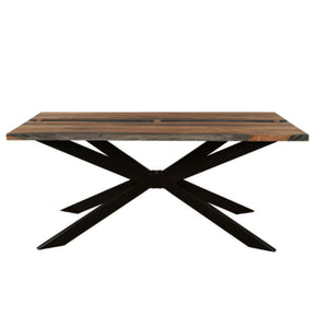 Wooden table with black metal X-shaped legs on a white background