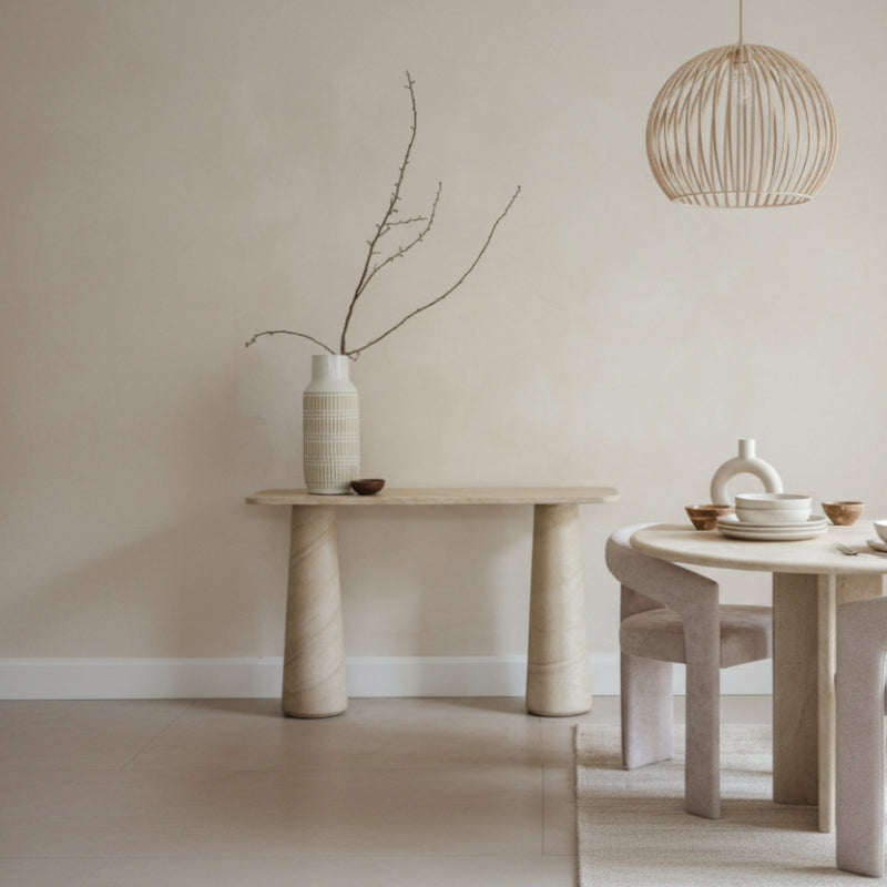 Beige console table with cylindrical legs on a white background