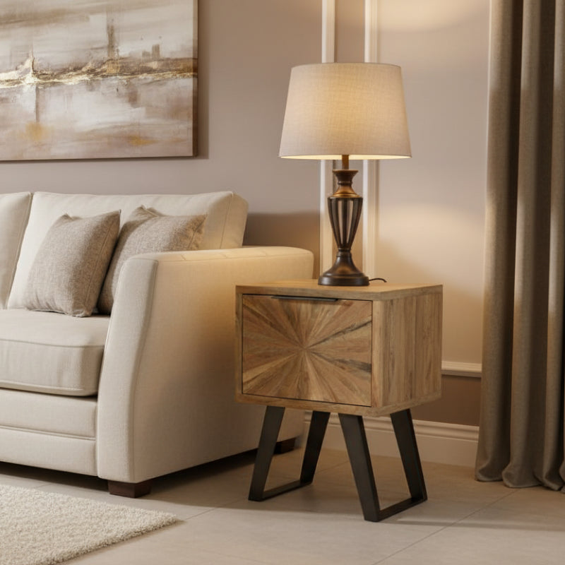 Wooden side table with starburst pattern on a white background